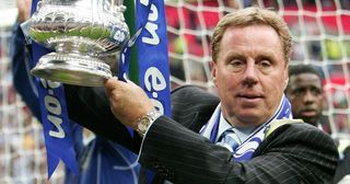 Portsmouth's Manager Harry Redknapp celebrating with the FA Cup trophy after their FA Cup final match against Cardiff City at Wembley football Stadium.