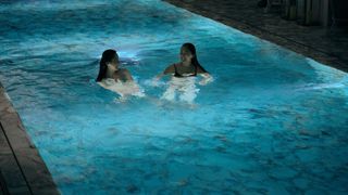 Mercy (Ji-young Yoo) and Charly (Bonde Sham) in the swimming pool in Expats episode 5