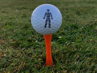 Prostate Cancer UK logo golf ball on a tee