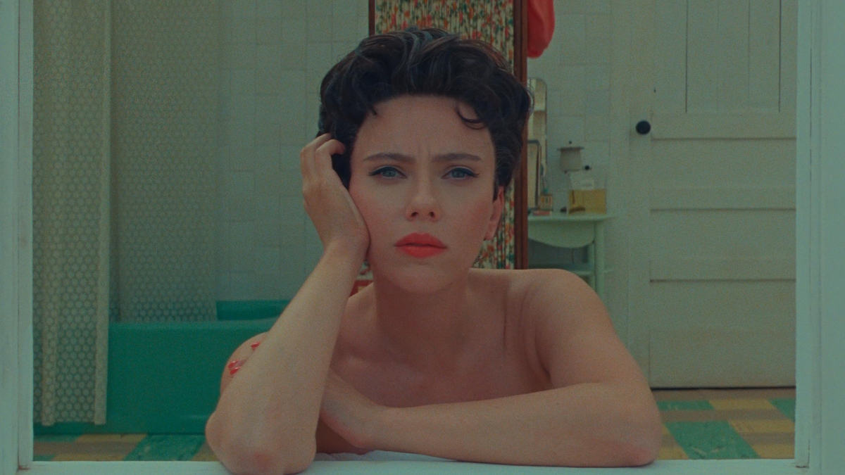 Scarlett Johansson sitting in a bathroom in Asteroid City
