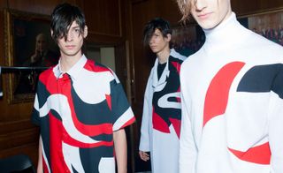 three male models wearing black red and white