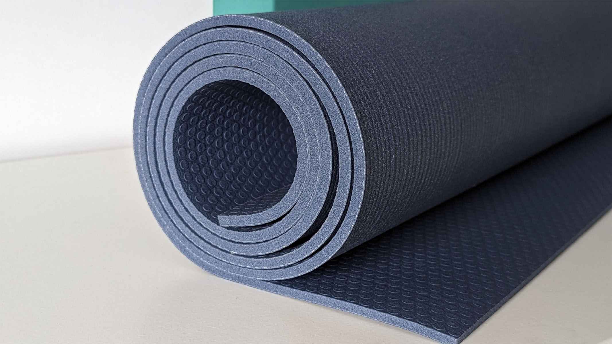 Manduka PRO yoga mat being propped up with a yoga block