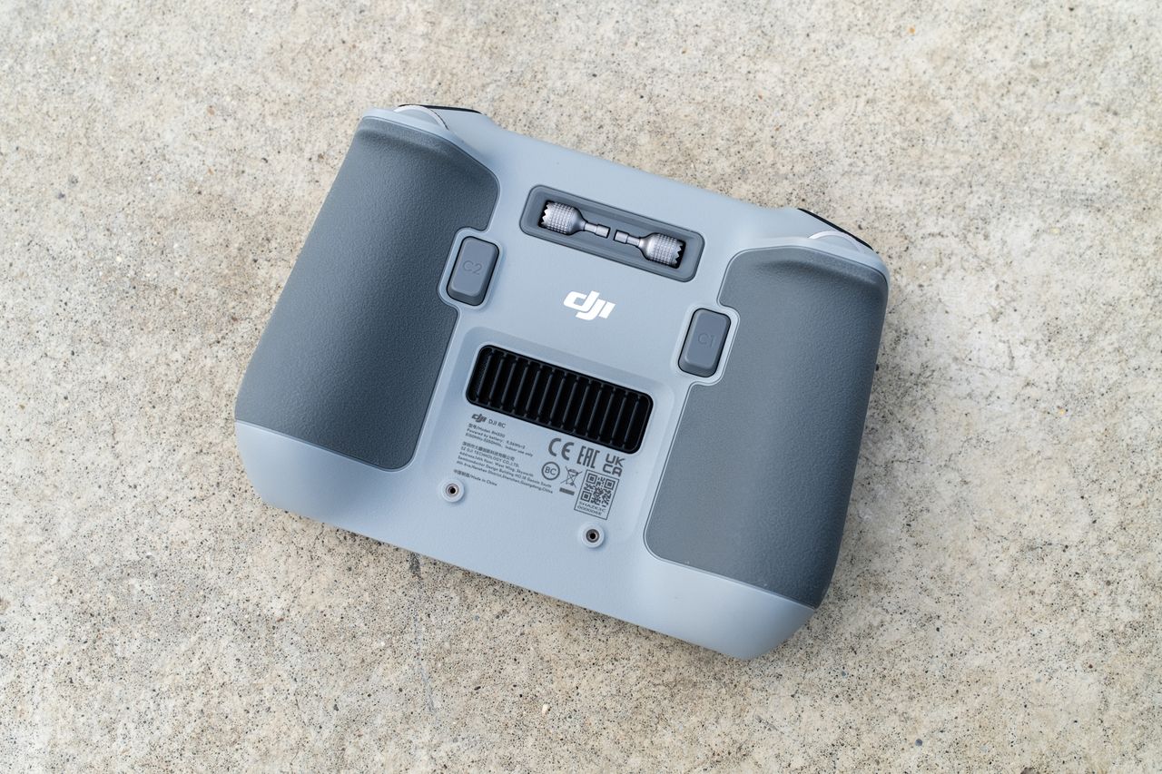 The DJI Mini 3 Pro drone resting on the ground