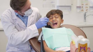 Is this boy feeling pain from his periodontal ligament or his dental pulp?