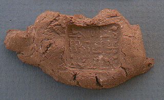An inscribed seal, used to hold the strings or binding of a papyrus scroll, was found near the fragments of a collar worn by a mummy. The inscription identifies the seal as being for Padihorwer, a man from the town of Qus who worked as an undertaker.