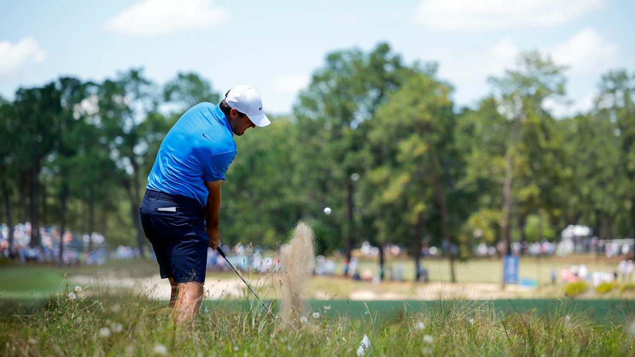 Scottie Scheffler takes a shot during a practice round before the US Open