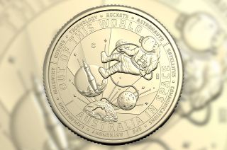 illustration of a coin's reverse with an astronaut and rocket launch depicted 