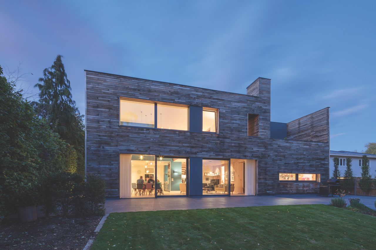 passivhaus self build with timber cladding at dusk