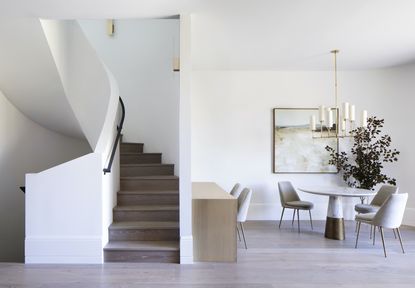 living space and staircase at Wraparound House, a San Francisco home by SAW