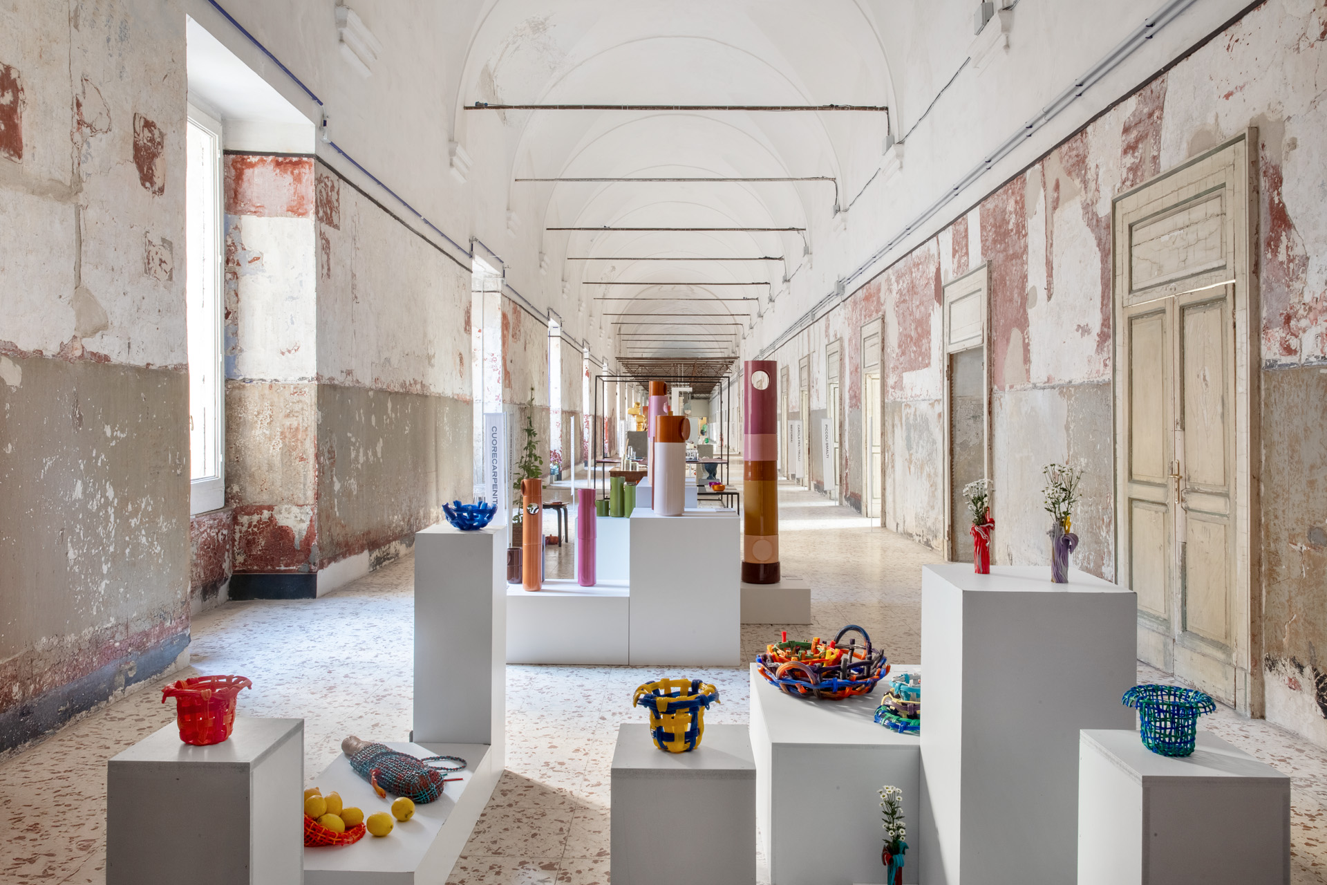 design objects arranged on plinths in a former hospital