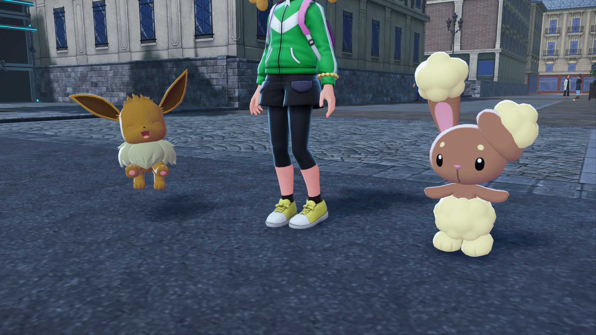Eevee and Buneary stand by a trainer in Pokemon Legends: Z-A.