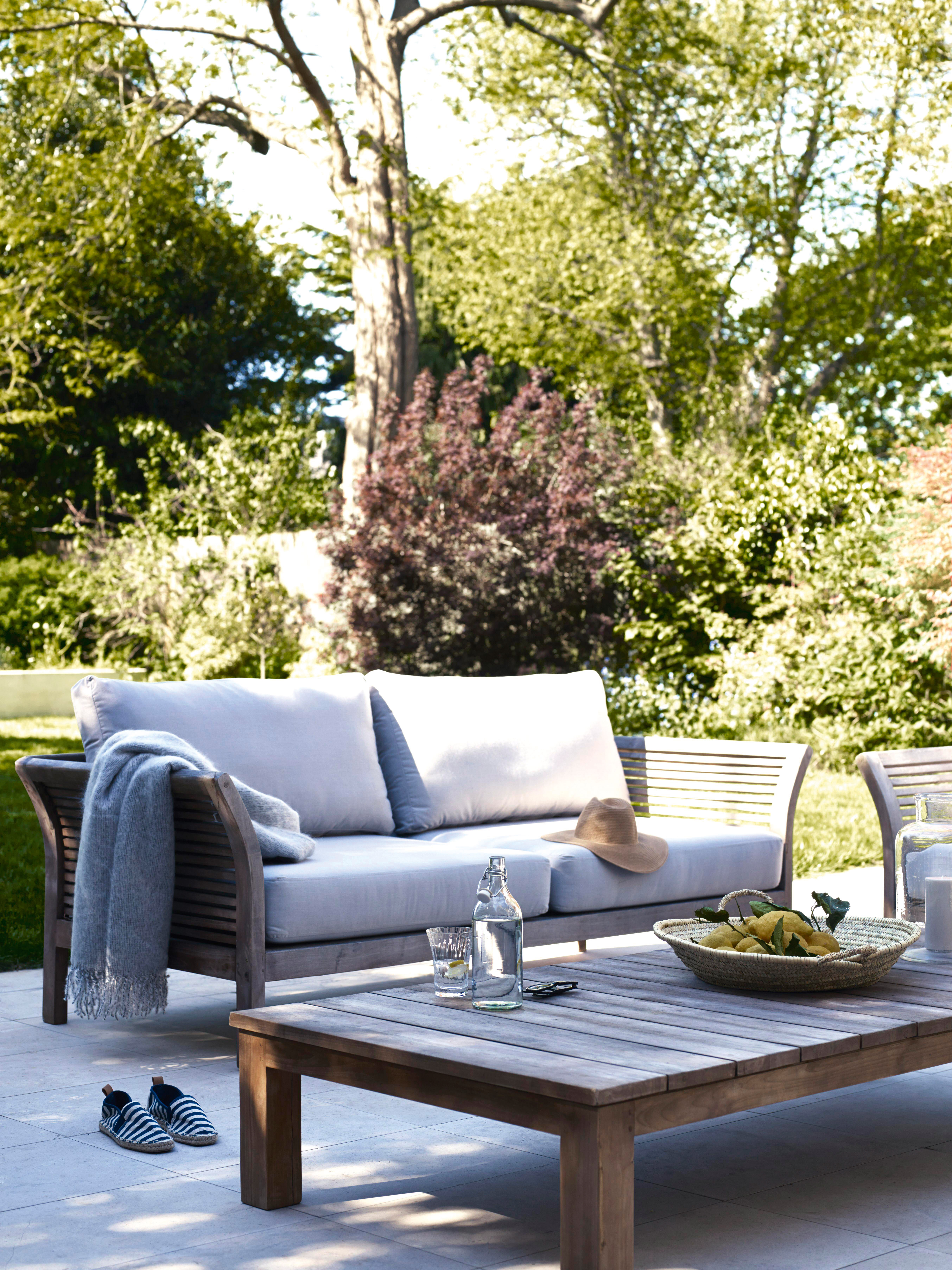 cream outdoor sofa in a garden