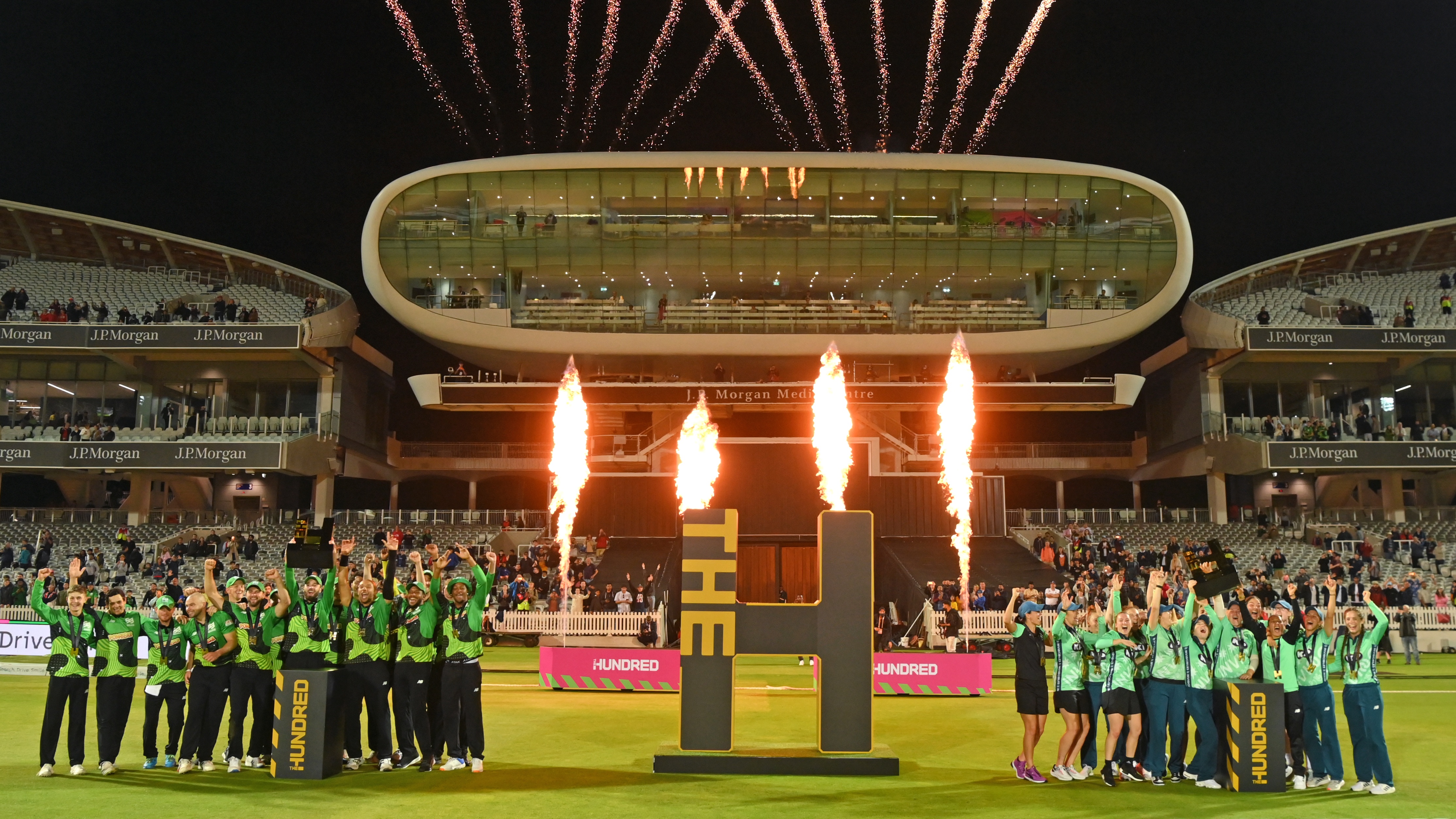 Champions The Southern Braves (l) and the Oval Invincibles (r) parade their trophies in front of the media centre and the Compton (l) and Edrich Stands after The Hundred Final match between Birmingham Phoenix Men and Southern Brave Men at Lord&#039;s Cricket Ground on August 21, 2021 in London, England. 