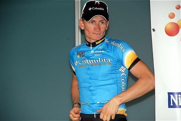 Andre Greipel (Team Columbia) heads to the podium for another leader's jersey presentation.