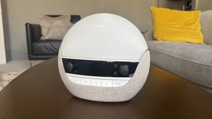 The unboxed Lumie Bodyclock Luxe 700FM sunrise alarm clock place on a coffee table.