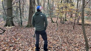 Man wearing The North Face Summit Series Futurefleece jacket in a forest – back view