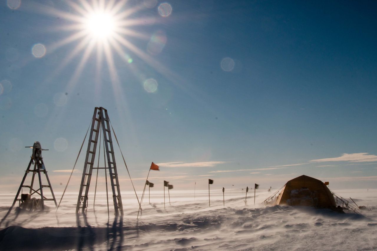 A windstorm at Thwaites Glacier blows snow over the drill tower, Icefin launch frame and control tent.