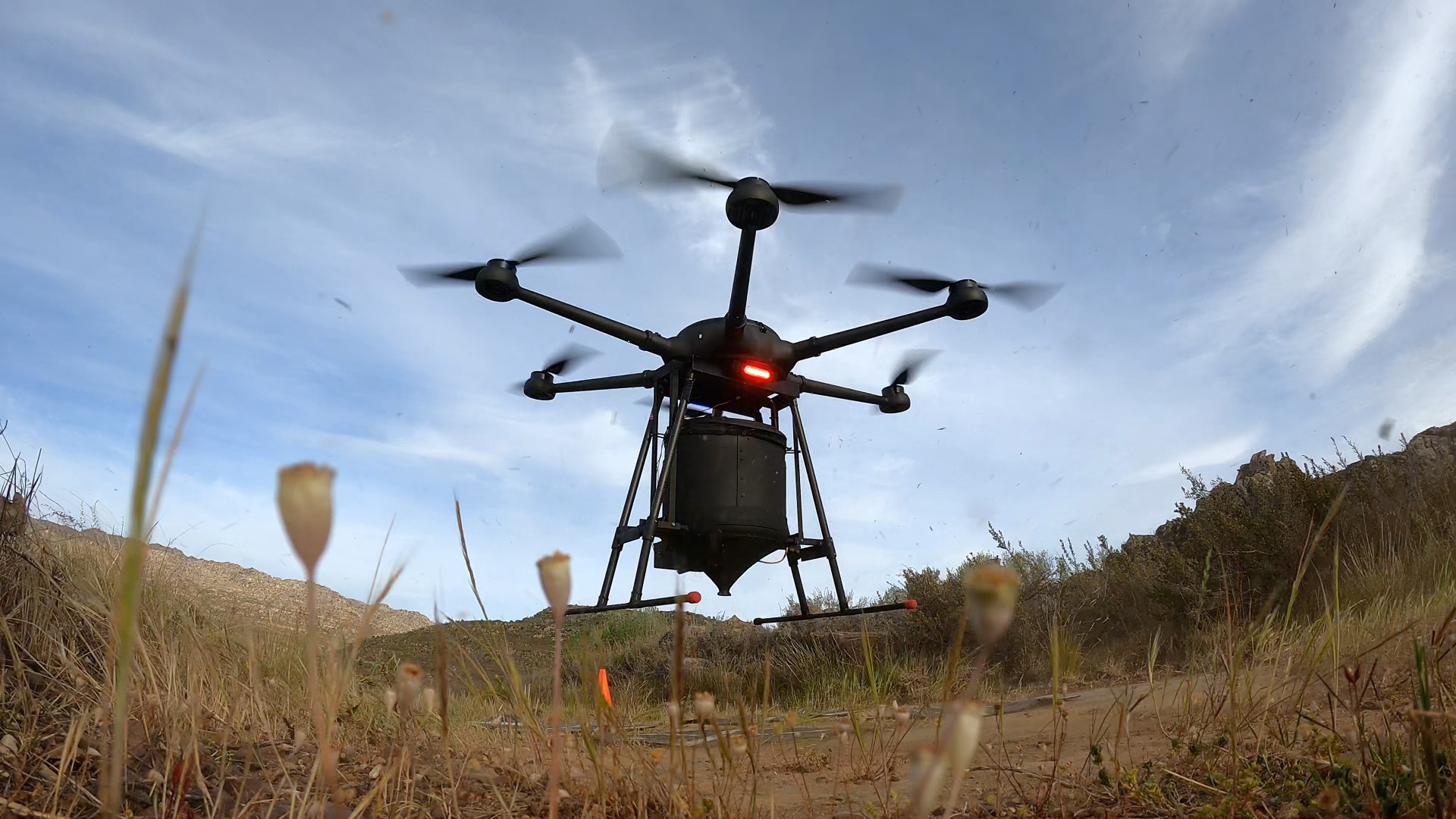 A large AirSeed drone with 6 propellors that can rapidly replant large areas of land.