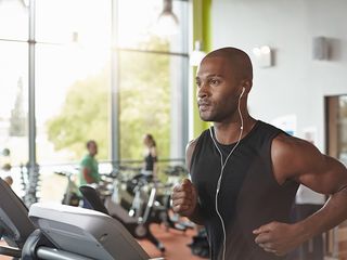 Man running on treadmill for fitness