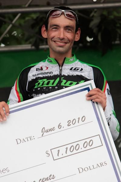 Cesar Grajales (Bahati Foundation) was happy to take home the King of the Wall check.