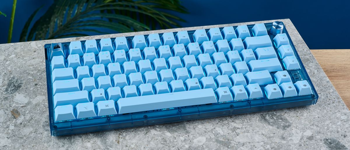 A glacier blue Corsair K65 Plus wireless mechanical keyboard for Mac