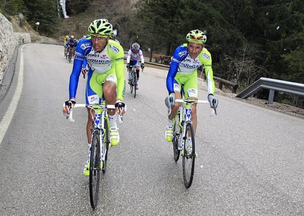 Liquigas-Cannondale's Eros Capecchi and Ivan Basso set a strong tempo in the peloton on the Passo Pordoi.