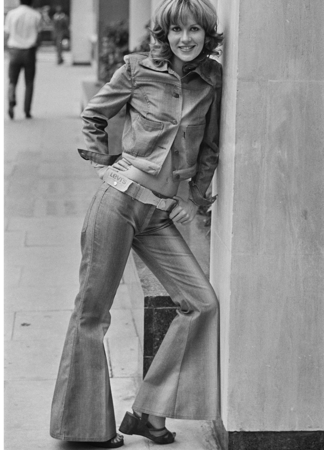 Model Bertie wearing a denim jacket and flared trousers at a preview of the Miss Levi spring collection at the Sonesta Tower Hotel, London, UK, 14th September 1971
