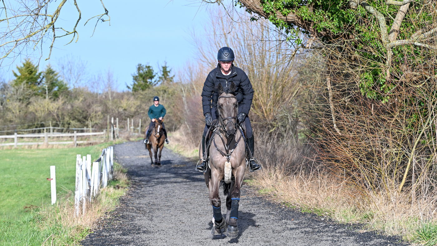 Will and Olli Fletcher cantering on all-weather track