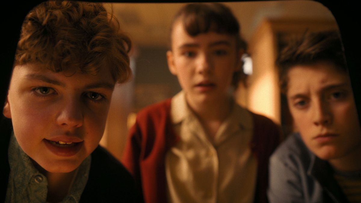 Teddy (Mikkal Karim-Fidler), Lilly (Clara Stack), and Phil (Jack Molloy Legault) in IT: Welcome to Derry.