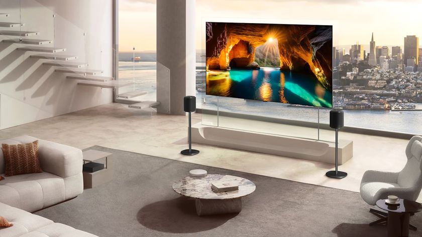 The LG W6 'Wallpaper' OLED TV, pictured mounted to a transparent sheet in a high-end apartment.