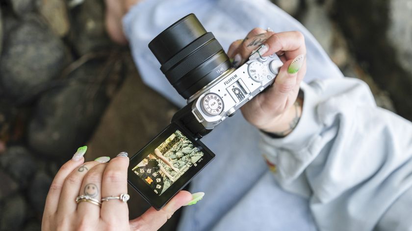 Fujifilm X-M5&#039;s screen flipped out and user selecting a film simulation