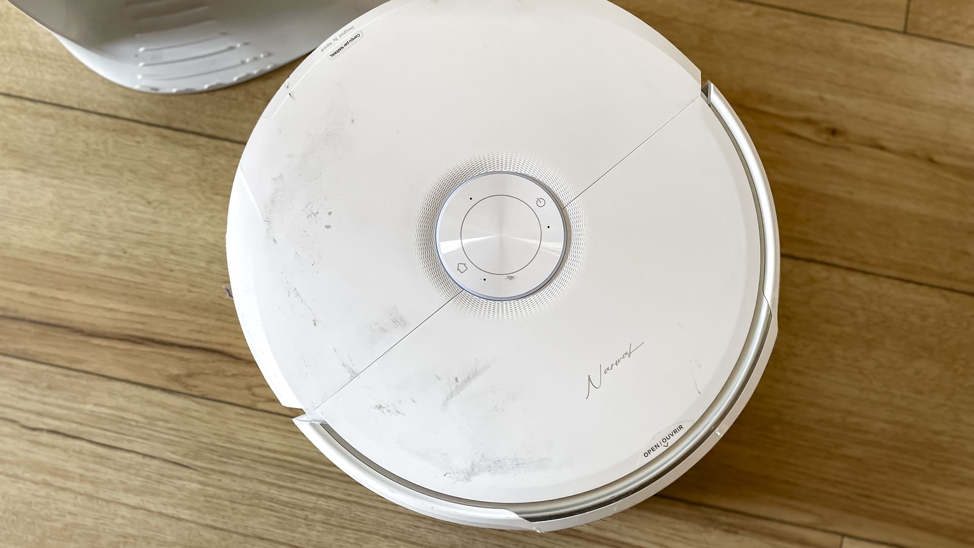 Narwal Freo 20 robot vacuum on a kitchen floor
