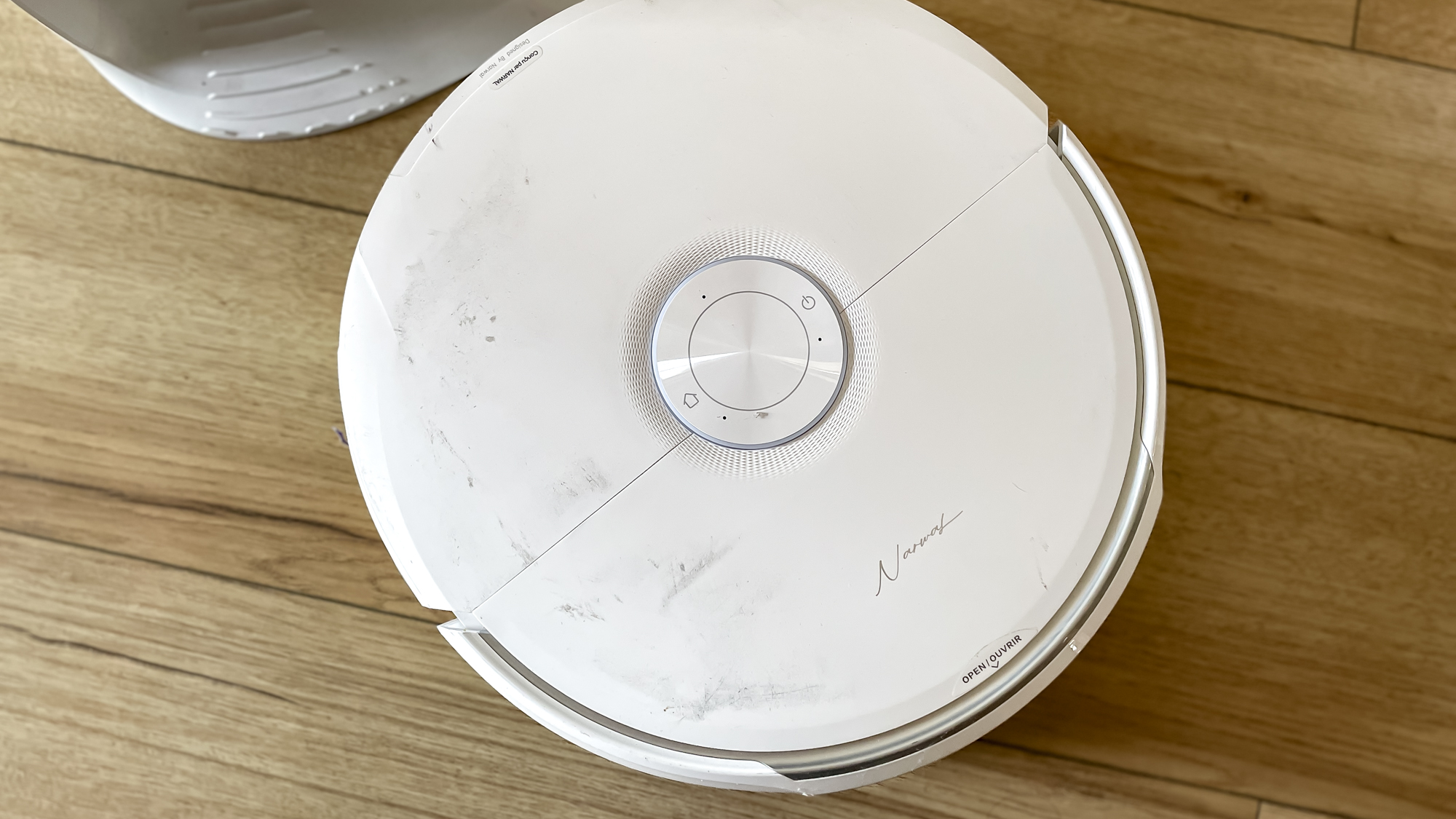 Narwal Freo 20 robot vacuum on a kitchen floor