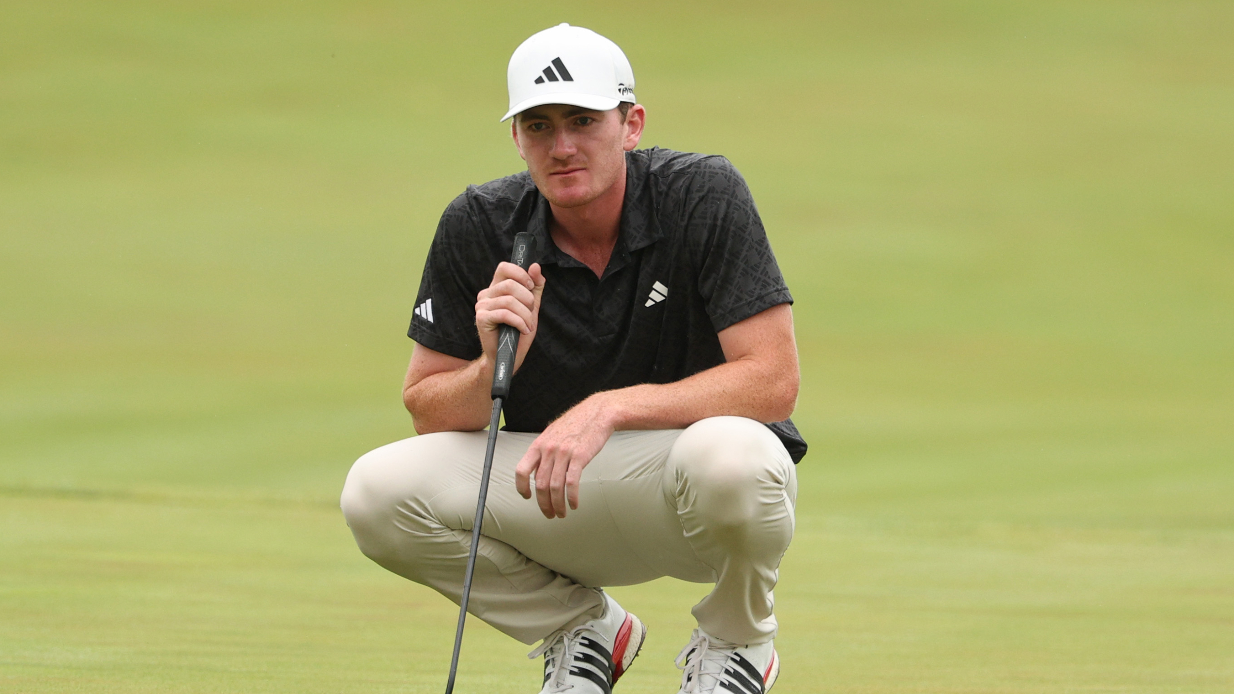 Nick Dunlap lines up a putt at the John Deere Classic