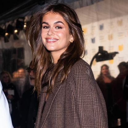 Kaia Gerber wore white chunky sneakers from On with a matching gym bag