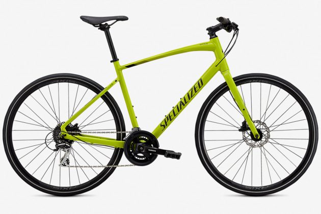 best commuting bikes includes the Specializes Sirrus 2.0 which is pictured in this image in bright Fluro green pointing front right.