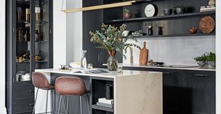 Black contemporary kitchen with glass fronted cabinets