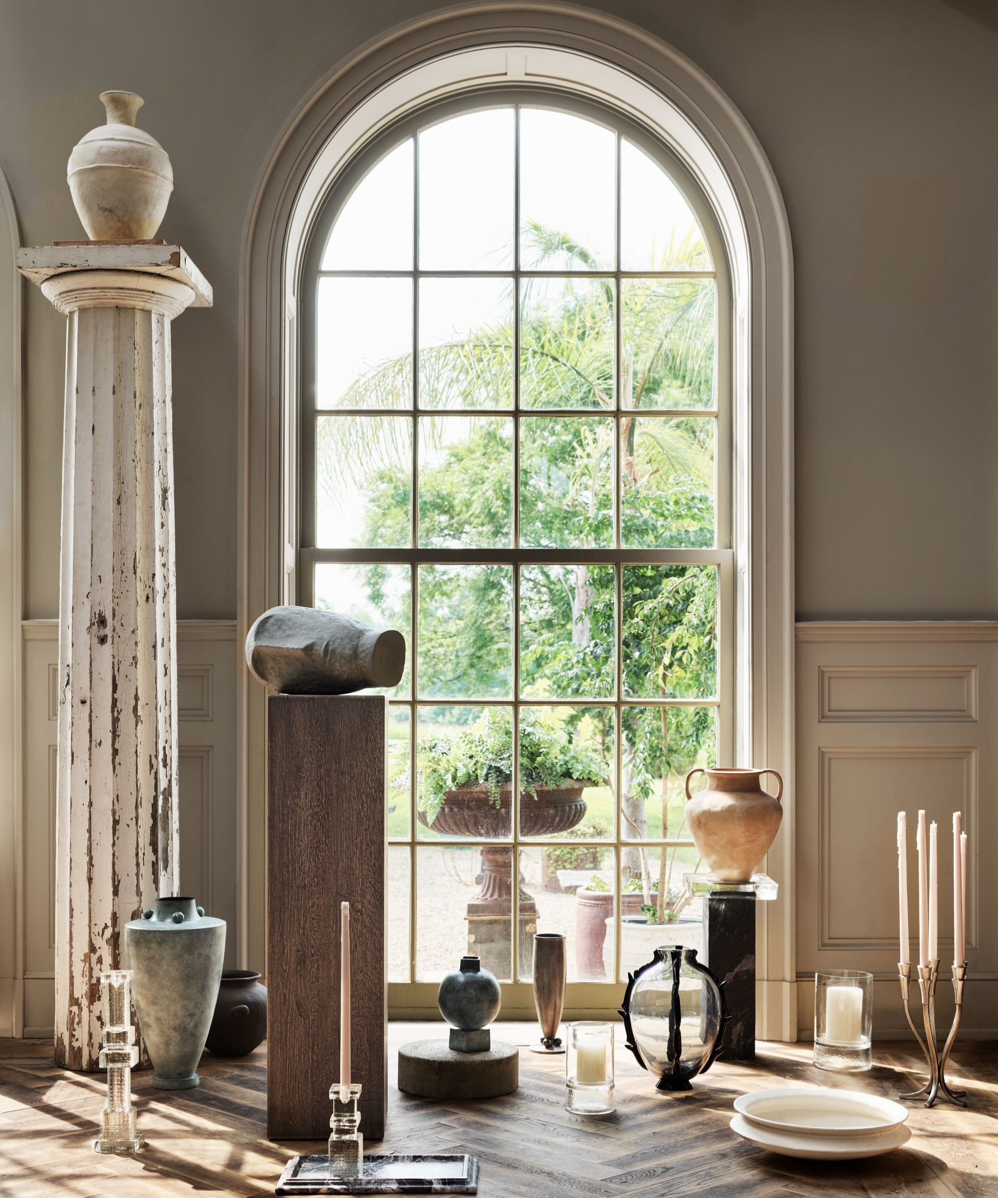 a collection of miscellaneous decor including vases, candle holders, bowls, and trays
