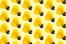 lots of yellow lightbulbs in a row on a yellow background