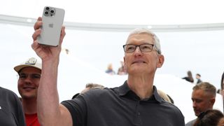 Tim Cook with iPhone 15