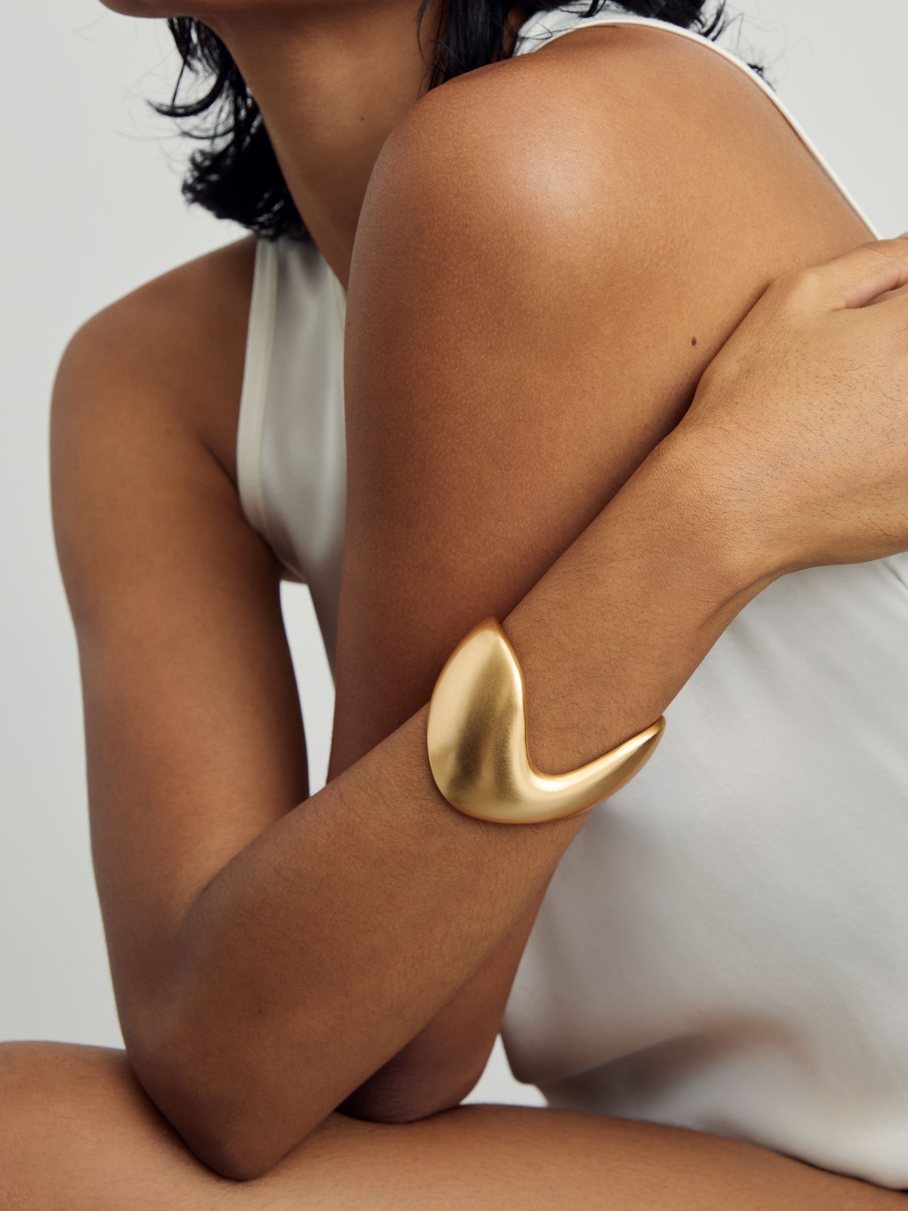 Sculpted Wave Cuff in Gold Tone
