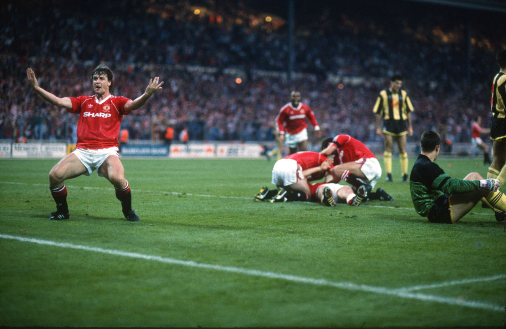 17 May 1990, Wembley - FA Cup Final Replay, Crystal Palace v Manchester Utd, Mark Hughes of Manchester Utd celebrates the winning goal scored by Lee Martin. (Photo by Mark Leech/Offside via Getty Images)