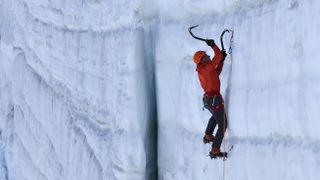 Person ice climbing with crampons