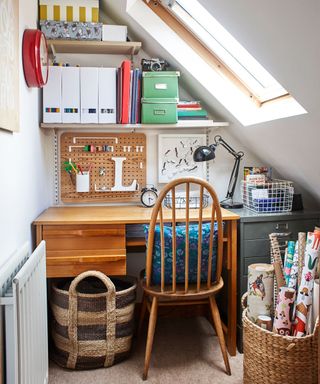 attic office room with table and shelves