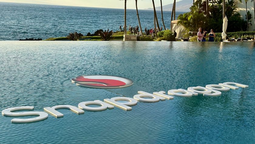 The Snapdragon logo sitting above water in a pool next to the ocean in Maui