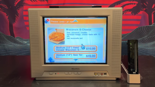 Someone peruses Domino's pizza menu via a Nintendo Wii and CRT TV screen.