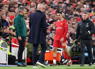 Liverpool's English defender #66 Trent Alexander-Arnold reacts following an injury during the last 16 second leg UEFA Champions League football match between Liverpool and Paris Saint-Germain (PSG) at Anfield in Liverpool, north west England on March 11, 2025. (Photo by Oli SCARFF / AFP) (Photo by OLI SCARFF/AFP via Getty Images)