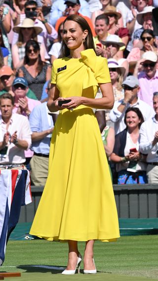 Kate Middleton in a yellow midi dress