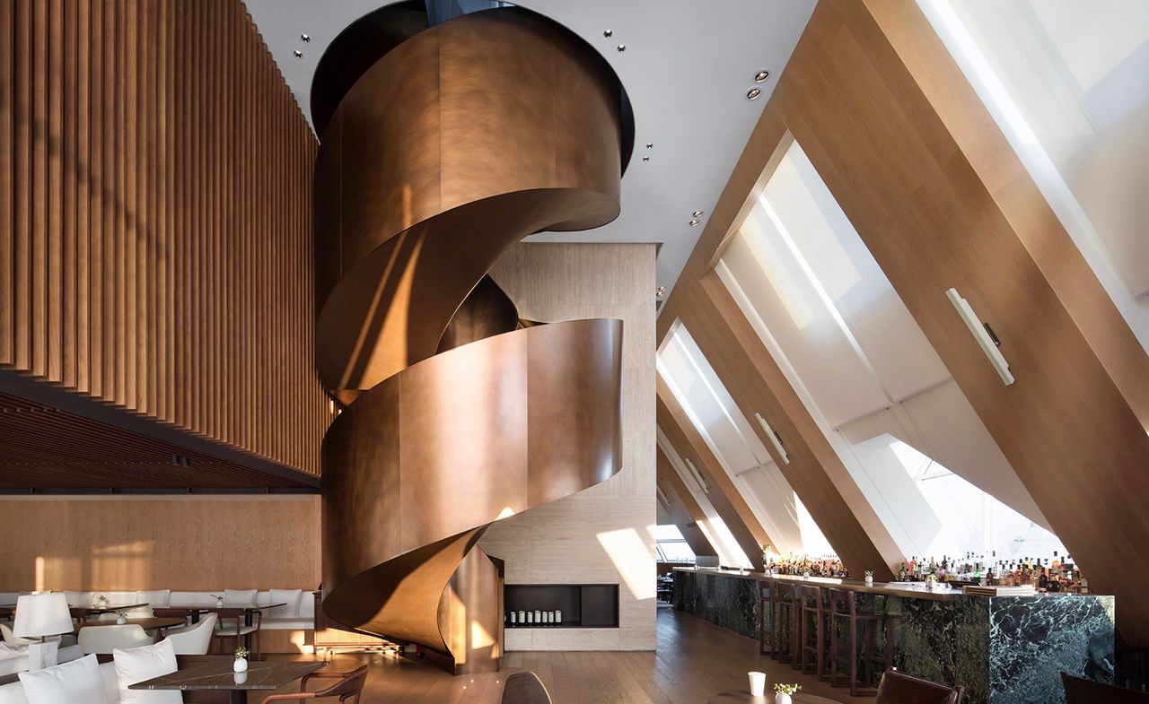 The aged bronze spiral staircase at Shanghai&#039;s Edition Hotel