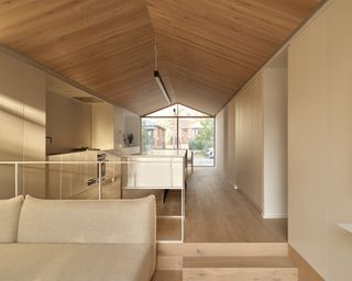 living space looking through Everden house by archollab
